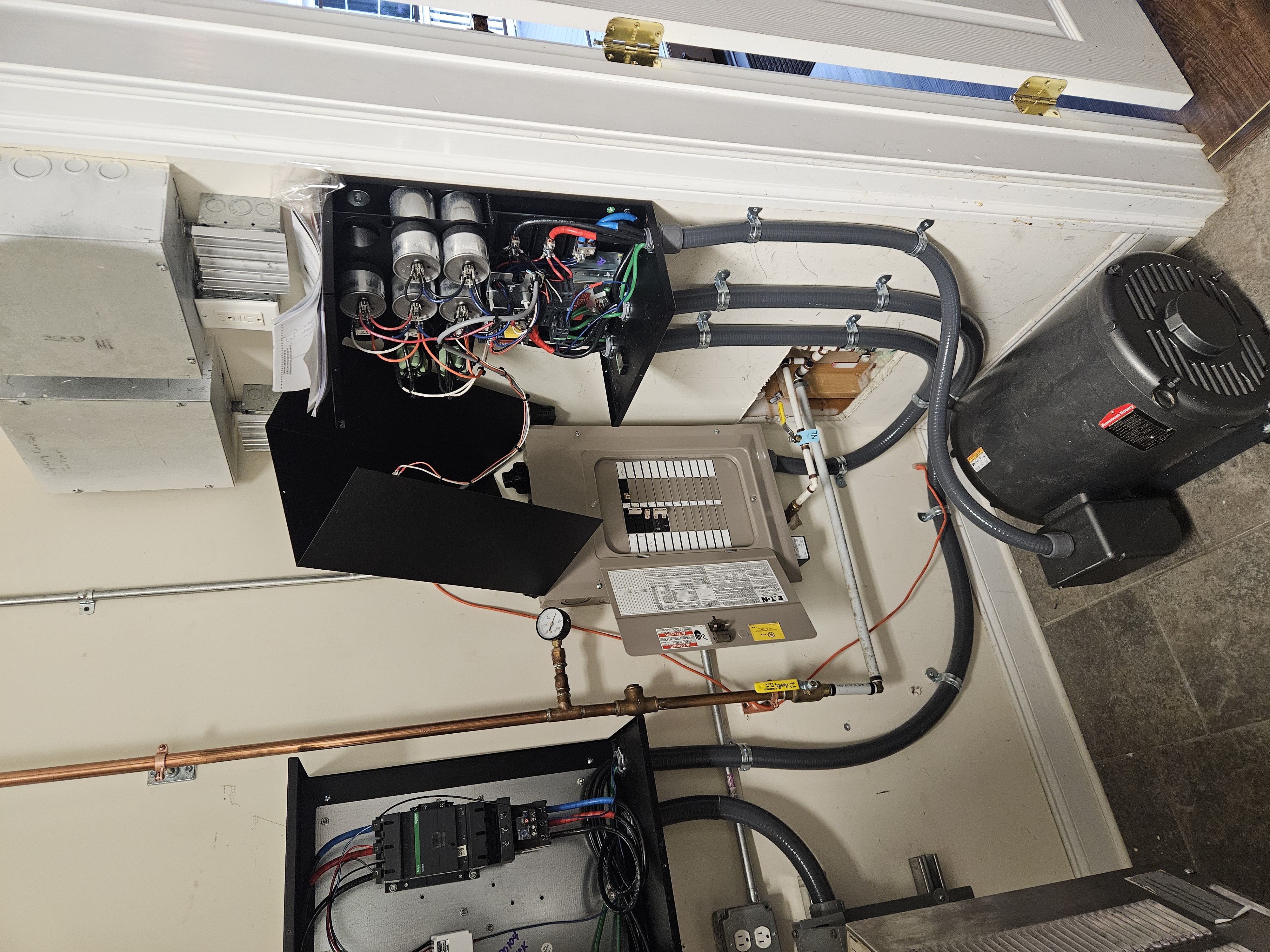 Industrial electrical panels with capacitors and liquid-tight conduit