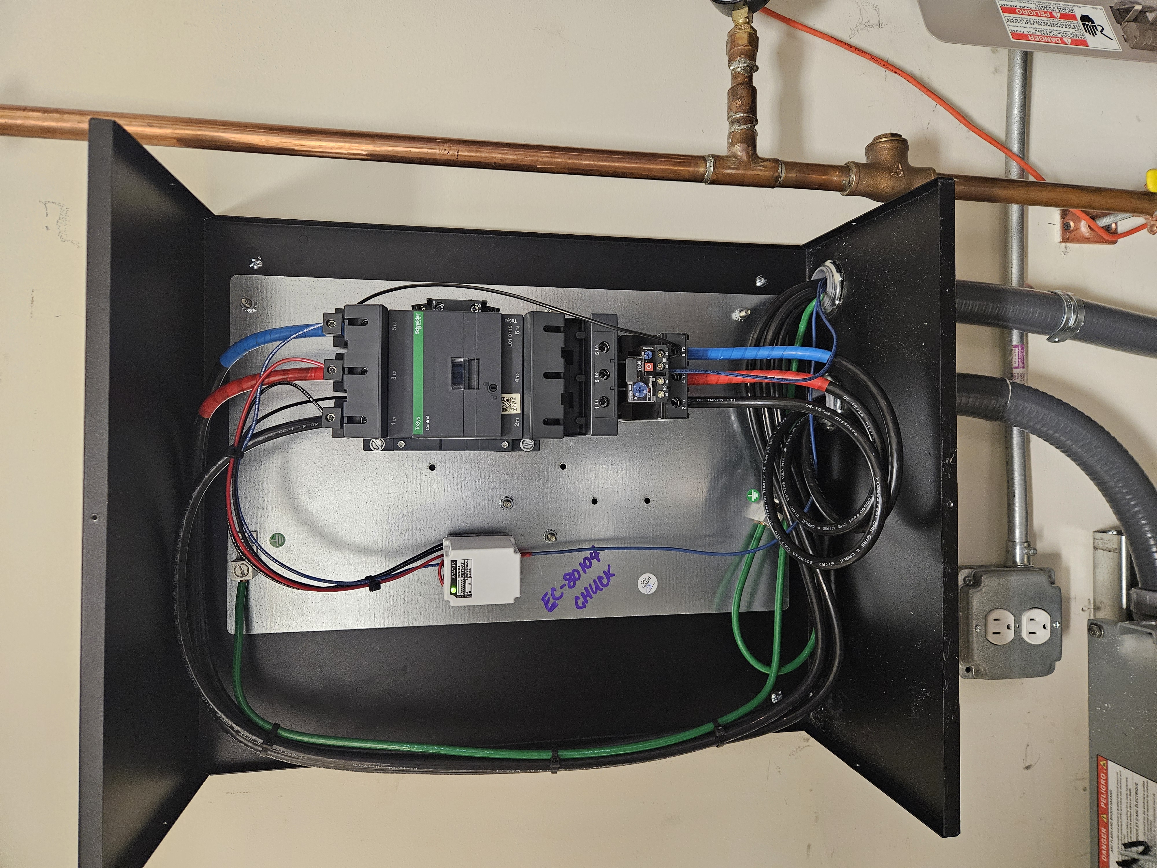 Schneider Electric TeSys industrial control panel with organized wiring